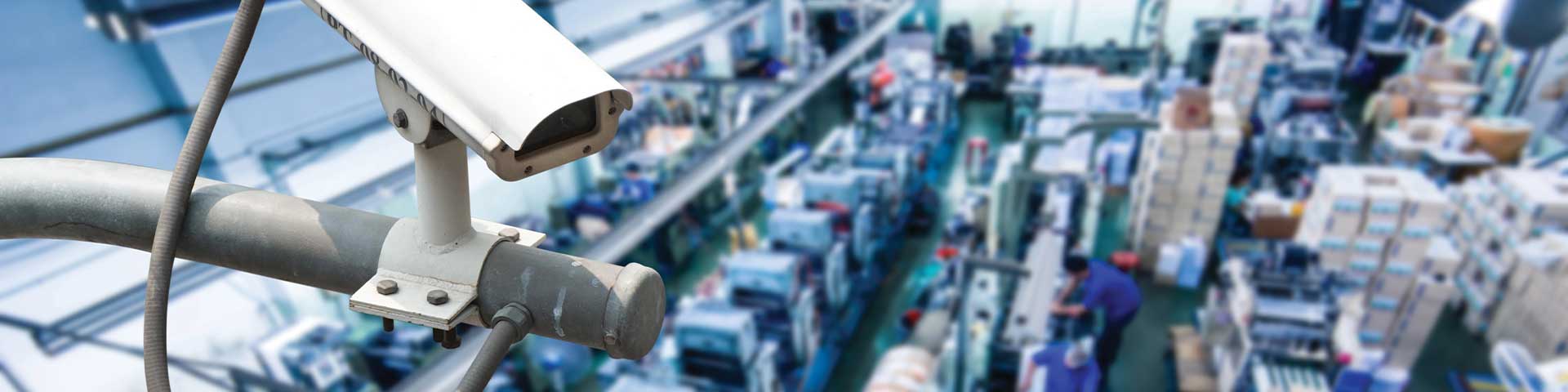Security camera monitoring busy factory floor